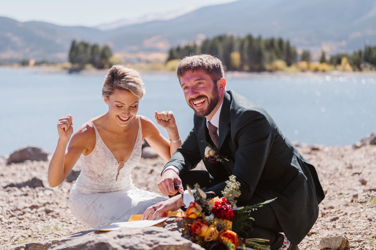 Couple signing their marriage license for their Breckenridge, Colorado elopement.