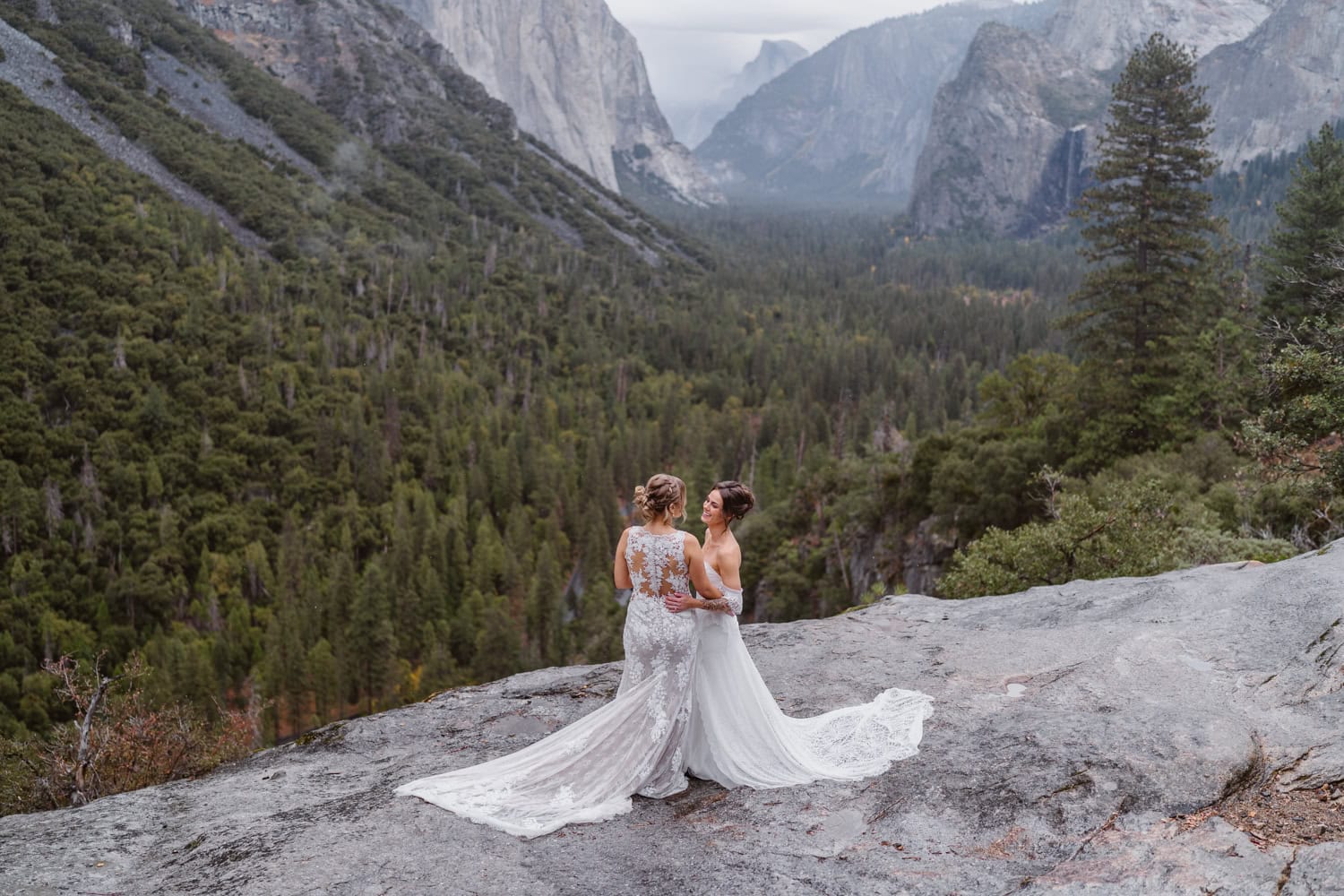 Two brides sharing a first look at Tunnel View in Yosemite.