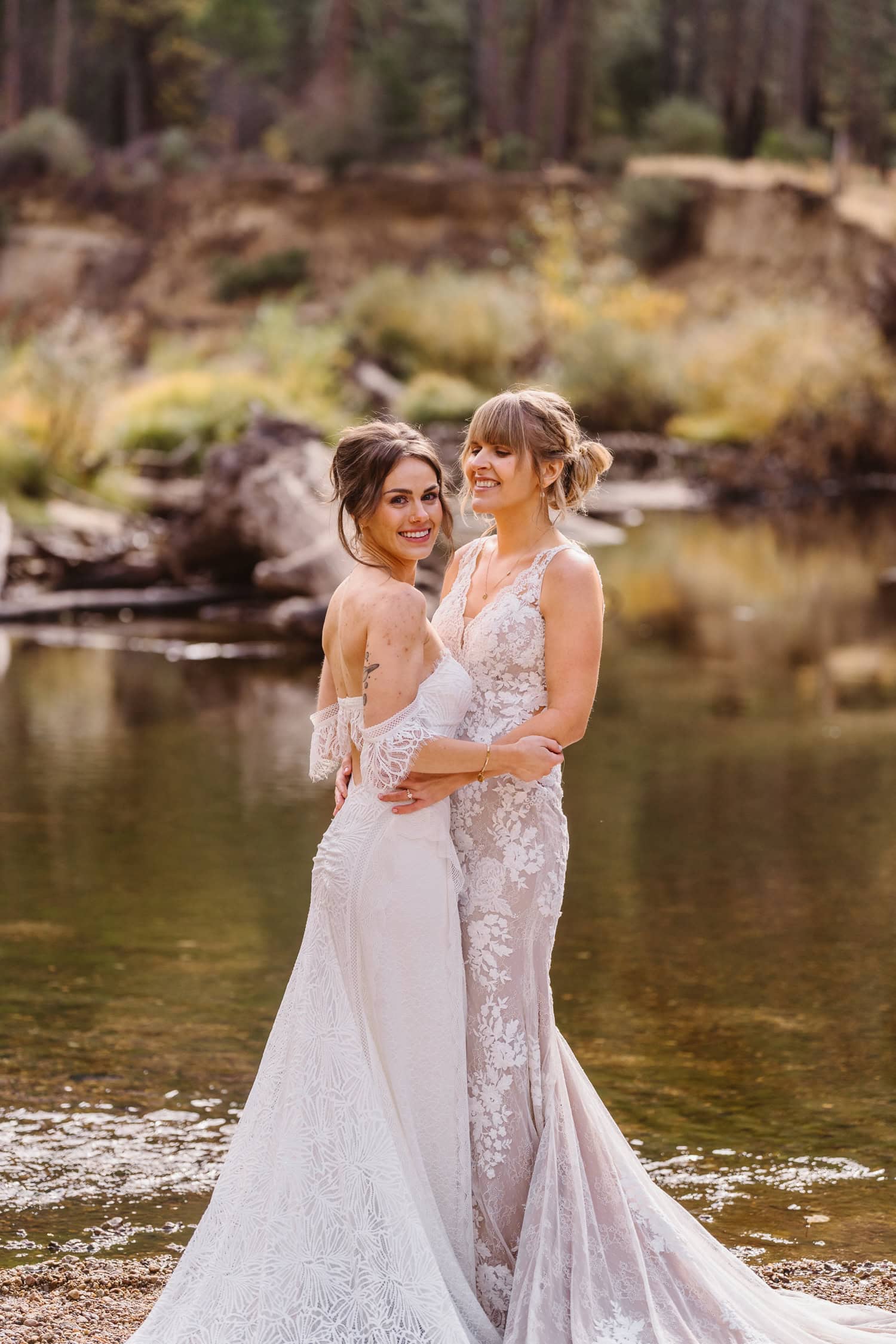 Bride and bride near the water for their elopement in Yosemite.
