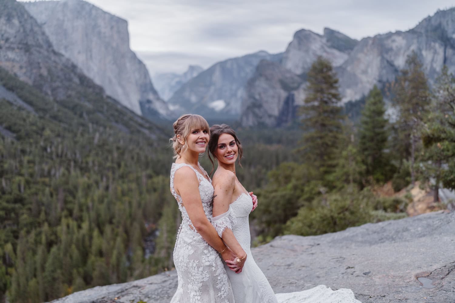 Two brides sharing a first look at Tunnel View in Yosemite.